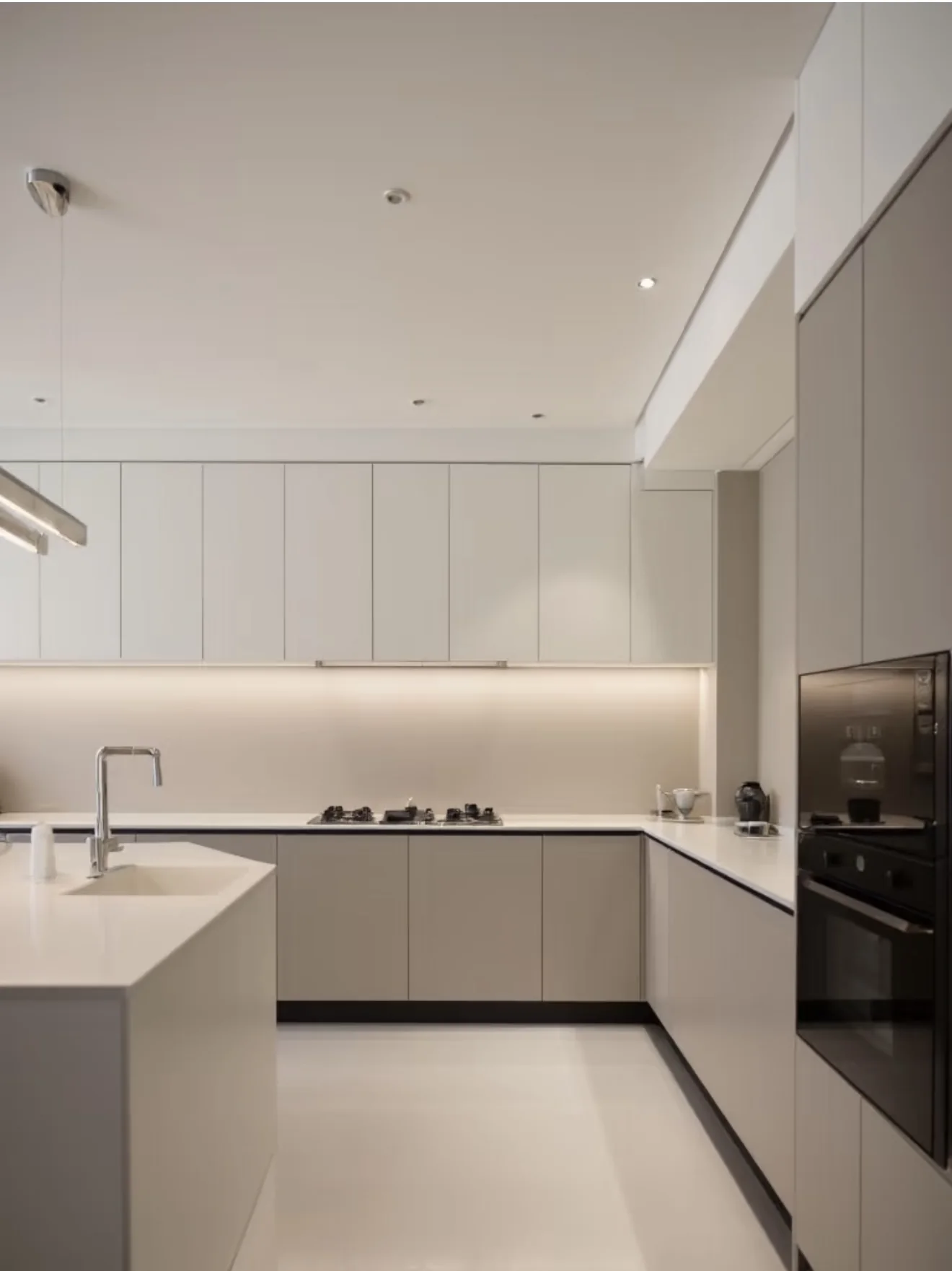 Minimalist beige kitchen with island
