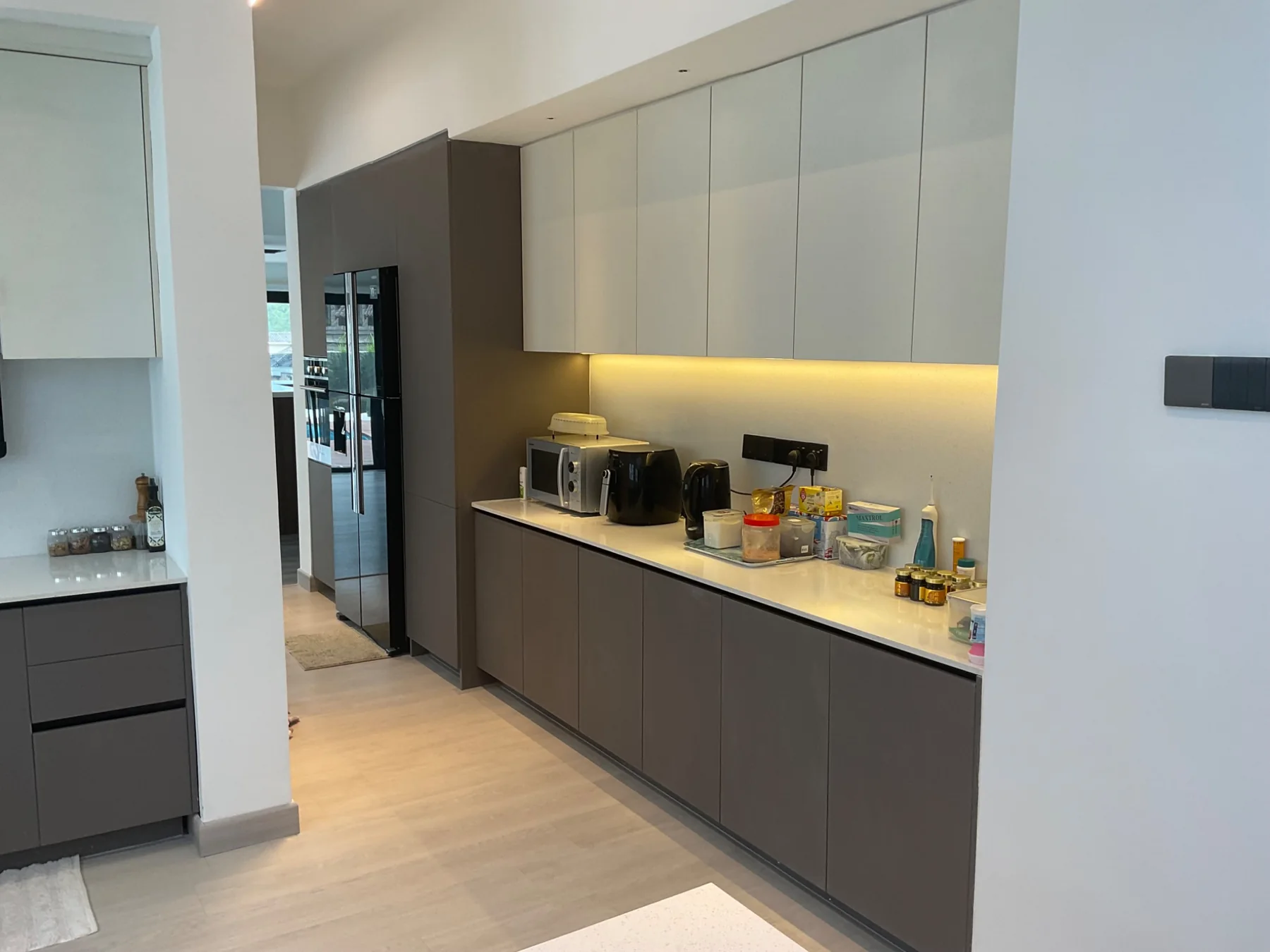 Grey and white kitchen with warm lighting